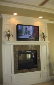 Fireplace and TV facing the bed in the master.