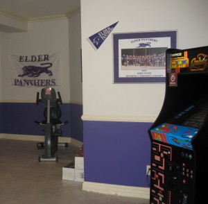 A "man's room" in the lower level that shows school pride.