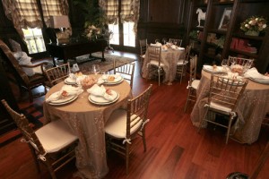 Living room set up for a dinner party or wedding reception.