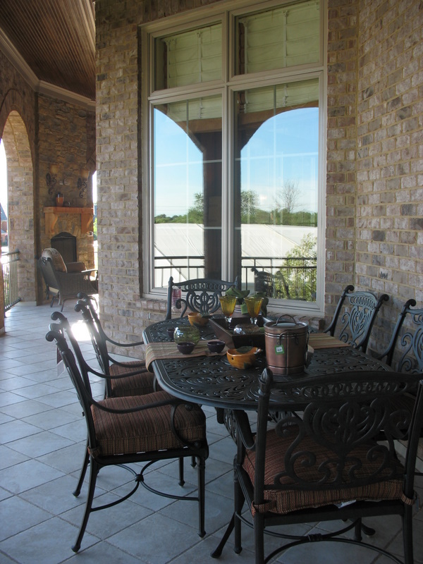 Covered porch that runs along the back of the house.