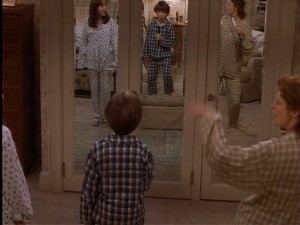As Ben and Anna lipsync to some Motown music with their mom, you get a glimpse of the mirrored closet doors in her bedroom.