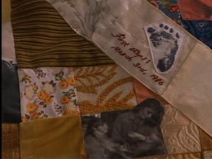 Close-up of the quilt Jackie made for Anna for Christmas, with photos and memorabilia stitched in.