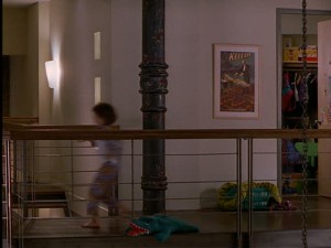 Luke's downtown apartment is a loft. In this fleeting shot, you could see the upstairs railing, open to the kitchen and living room below.