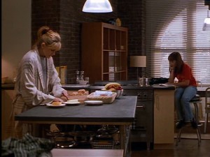 The kitchen in Luke's loft is spare, modern, and open.