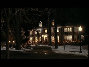 The house lit up at night to deter (bungling) burglars.