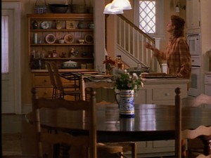 Jackie's kitchen has a back staircase coming down into it.
