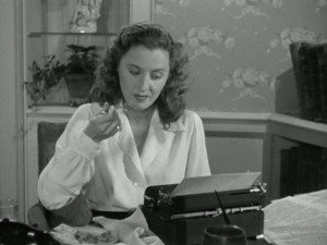 Elizabeth Lane sits in her apartment, writing about her (pretend) life on a Connecticut farm.