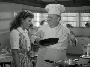 Felix tries to teach Elizabeth how to flip flapjacks.