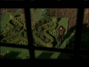 Jane watches Rochester pacing in the garden below her bedroom window. What's he so tormented about?