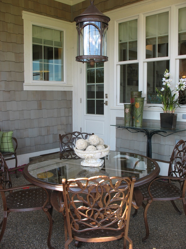 Covered porch off the kitchen and family room.