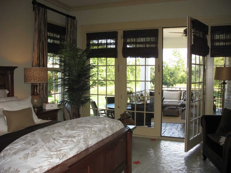 French doors lead from the master bedroom onto a covered porch.