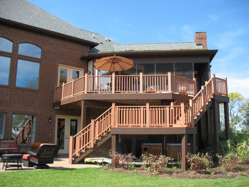 Back of the house shows the two-tier deck and the basement walk-out.