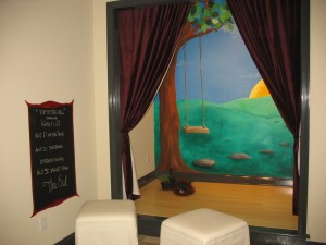 A cute little theater set up for children to play in.
