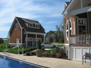 A separate garage has an apartment that can be used as an office, artist's studio, or guest cottage above it.
