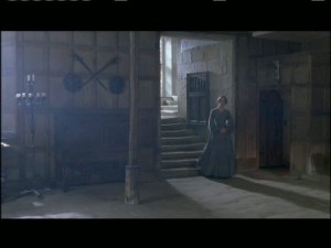 Jane steps down into the back hall.