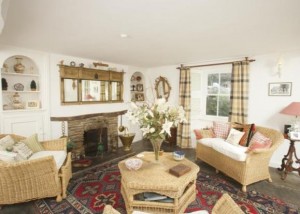 living room with stone fireplace