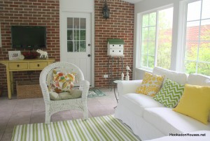 striped rug, sofa, brick wall 7-11