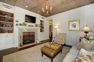 TV room with wood ceiling and fireplace
