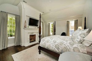 white bedroom with fireplace