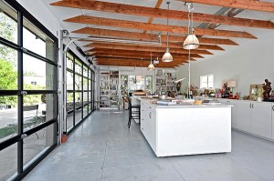 art studio with glass roll-up garage doors
