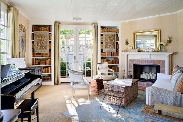 living room with piano and fireplace