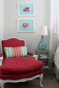 red chair in corner of daughter's bedroom