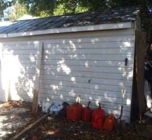 gas cans behind garage