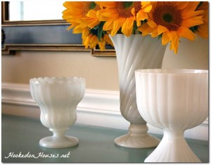 Milk glass with sunflowers in dining room-cover