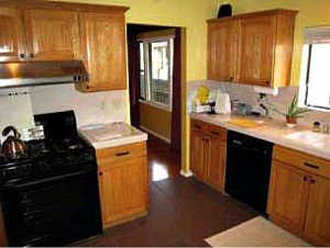 dark wood kitchen black appliances before
