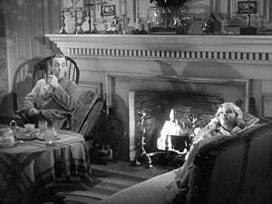 Bing Crosby and Marjorie Reynolds by the fire