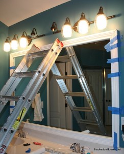 framing the bathroom plate glass mirror