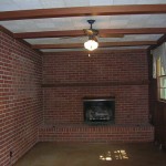 A room with a brick wall