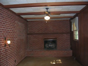 A room with a brick wall
