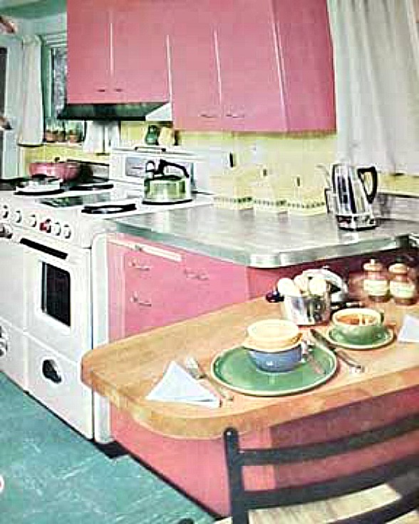 a kitchen with pink cabinets from 1956