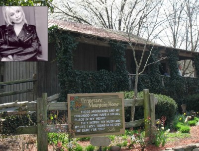 A sign on the side of Dolly Parton's cabin saying Tennessee Mountain Home