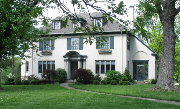 white house with shutters and flower boxes