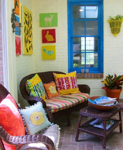 A room with a couch and a table in front of a window