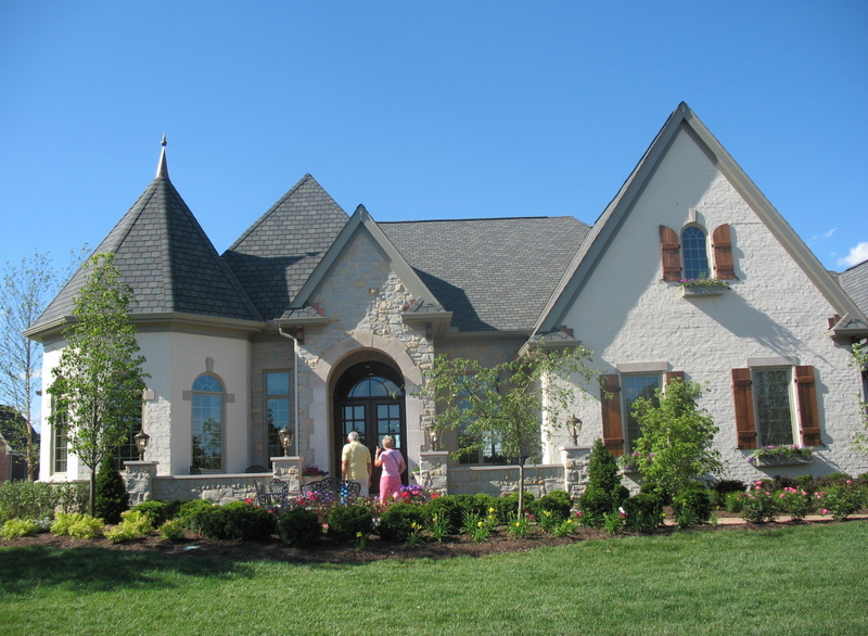 large brick house painted white