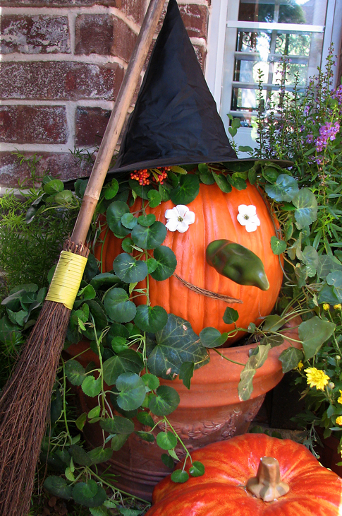 pumpkin decorated like a witch