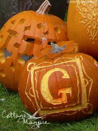 A close up of some monogrammed pumpkins