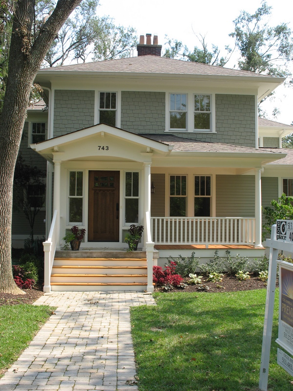 old house with porch and Craftsman style door