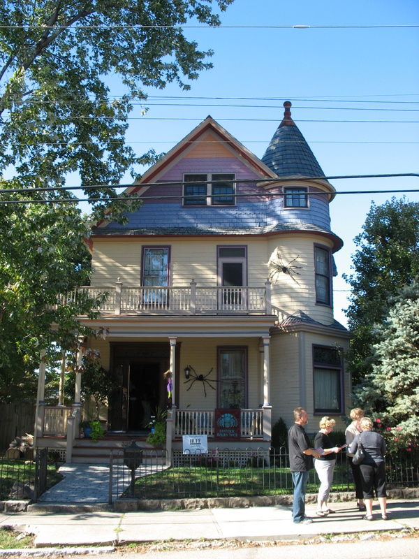 house decorated for Halloween with giant spiders