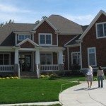 front exterior of shingle style house in home show