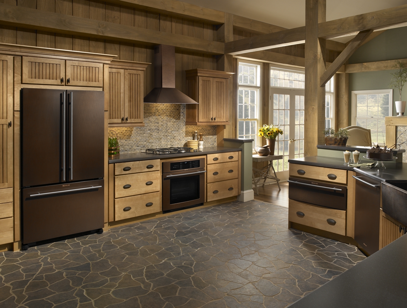 A large kitchen with bronze appliances