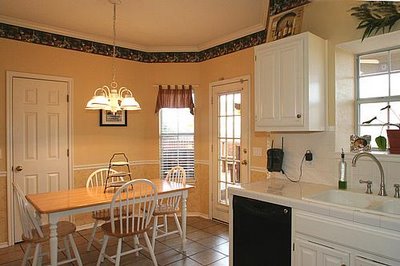 A kitchen with a dining room table