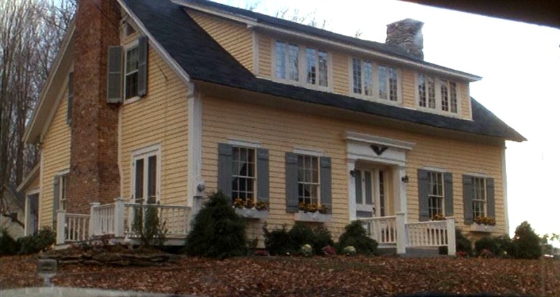 Yellow Baby Boom movie house with shutters