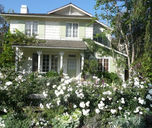 front exterior of Brooke's beach house with rose garden