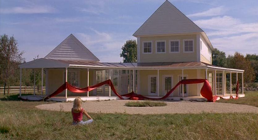 Housesitter movie yellow house with red ribbon