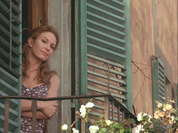 Diane Lane standing in open doorway looking outside