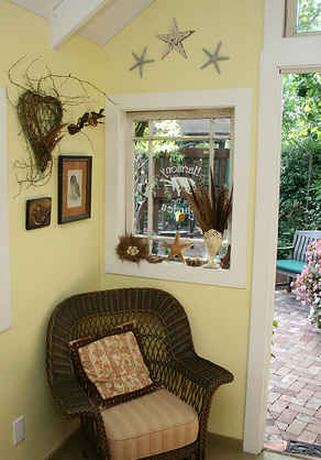 wicker chair inside cottage garden